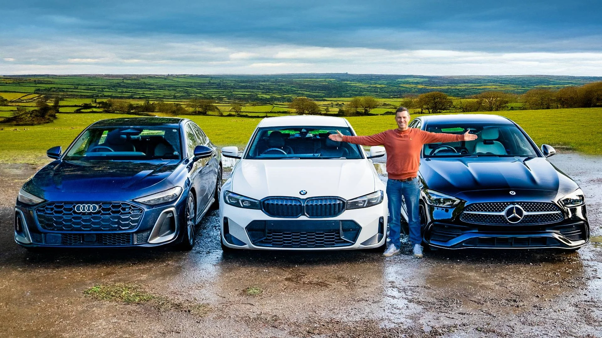 Audi, BMW и Mercedes на фоне зелёных холмов